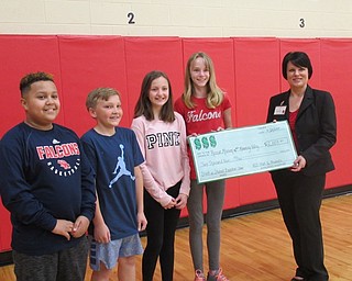 Neighbors | Jessica Harker.Students at Austintown Intermediate School presented the check of $2,009 to a representative of the Rescue Mission on April 23.
