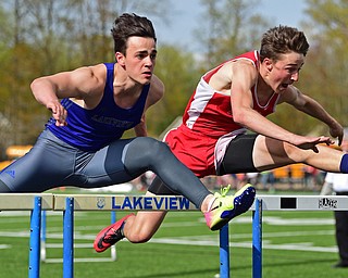 Badger's Brandon Greathouse, right, and Lakeview's Liam Boivin compete during the boys 110 meter hurdles, Thursday afternoon during the Trumbull County Track Meet at Lakeview High School. 