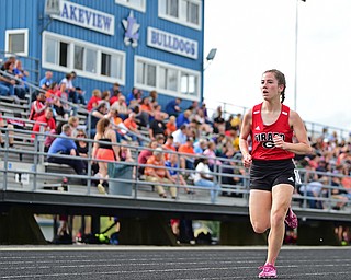 CORTLAND, OHIO - MAY 2, 2019: Girard's Nicole Chalker runs to the finish line to win her heat of the girl 1600 meter run, Thursday afternoon during the Trumbull County Track Meet at Lakeview High School. DAVID DERMER | THE VINDICATOR