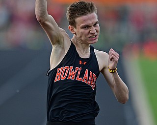 CORTLAND, OHIO - MAY 2, 2019: Howland's Vincent Mauri celebrates while crossing the finish line to win his heat of the boys 1600 meter run, Thursday afternoon during the Trumbull County Track Meet at Lakeview High School. DAVID DERMER | THE VINDICATOR