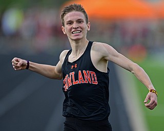 CORTLAND, OHIO - MAY 2, 2019: Howland's Vincent Mauri celebrates while crossing the finish line to win his heat of the boys 1600 meter run, Thursday afternoon during the Trumbull County Track Meet at Lakeview High School. DAVID DERMER | THE VINDICATOR