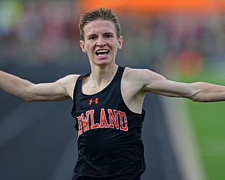 CORTLAND, OHIO - MAY 2, 2019: Howland's Vincent Mauri celebrates while crossing the finish line to win his heat of the boys 1600 meter run, Thursday afternoon during the Trumbull County Track Meet at Lakeview High School. DAVID DERMER | THE VINDICATOR