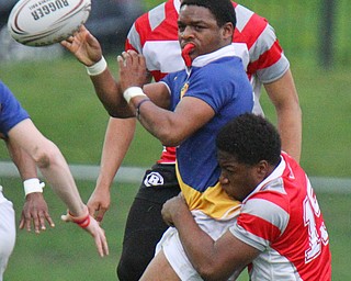 William D. Lewis The vindicator East's Vincent Steele(15) passes as he is hit by Chaney's Rashawn Perkins(15) during 5-3-19 action.