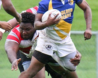 William D. Lewis The Vindicator  EastsJarail Jenkins(10) eludes Chaney's Shawn Rollins(5).