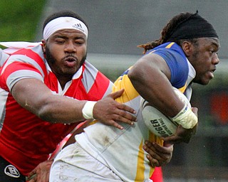 William D. Lewis The vindicator  Easts DMarcus Carr(12) eludes Chaney's MyTwan Cottie(7).