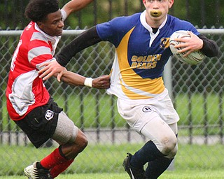 William D. Lewis The Vindicator  East's Samuel Cartagena(13) eludes Chaney's TeShawn Jones(11).