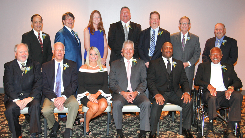 The 2019 Curbstone Coaches Hall of Fame honorees are (seated from left): Len Holman, Roger Kreps, Dianne Rappach-Kosco, guest speaker John Hirschbeck, Leo Hawkins and Jim Snowden; and (standing) Joe Jeswald, Sam Naples, Teri Haefke, Kirk Baker, Rick Kang, Pat Lorelli and Atty. Lou Schiavoni.