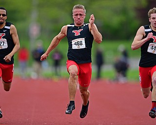 YOUNGSTOWN, OHIO - MAY 5, 2019: Youngstown State's Chad Zallow sprints ahead of Josh Beaumont, left, and Brendan Lucas, right, during the Men's 100 meter, Sunday afternoon during the Horizon League Outdoor Track Championship at the Youngstown State Sports Complex. DAVID DERMER | THE VINDICATOR