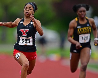 YOUNGSTOWN, OHIO - MAY 5, 2019: Youngstown State's Jaliyah Elliott, sprints to the finish line head of Milwaukee's Mercy Ndon during the women's 100 meter, Sunday afternoon during the Horizon League Outdoor Track Championship at the Youngstown State Sports Complex. DAVID DERMER | THE VINDICATOR