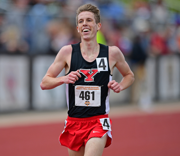 YOUNGSTOWN, OHIO - MAY 5, 2019: Youngstown State's Ryan Sullivan smiles while crossing the finish line to place second during the Men's 5000 meter, Sunday afternoon during the Horizon League Outdoor Track Championship at the Youngstown State Sports Complex. DAVID DERMER | THE VINDICATOR