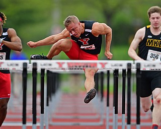 YOUNGSTOWN, OHIO - MAY 5, 2019: Youngstown State's Chad Zallow clears a hurdle while racing Collin Harden, left, and Milwaukee's Sam Conger during the Men's 110 meter hurdles, Sunday afternoon during the Horizon League Outdoor Track Championship at the Youngstown State Sports Complex. DAVID DERMER | THE VINDICATOR