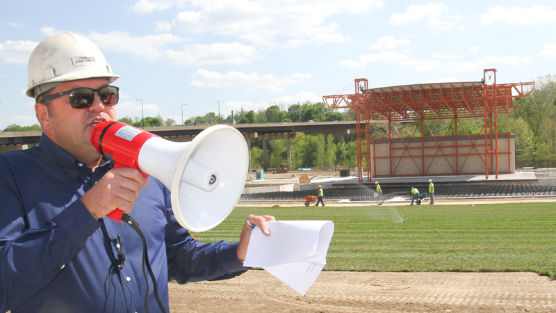Eric Ryan, president of JAC LIVE and JAC Management Group, leads media members on a tour of the Youngstown Foundation Amphitheatre downtown at the site of the former Wean United building. The $8 million recreation venue is scheduled to open June 14. Behind Ryan is the amphitheater stage. The tour took place Monday afternoon.