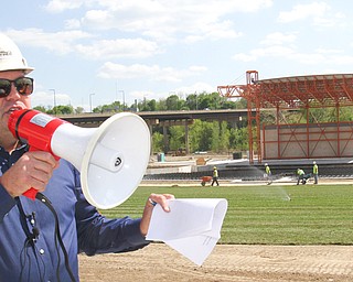 Eric Ryan, president of JAC LIVE and JAC Management Group, leads media members on a tour of the Youngstown Foundation Amphitheatre downtown at the site of the former Wean United building. The $8 million recreation venue is scheduled to open June 14. Behind Ryan is the amphitheater stage. The tour took place Monday afternoon.