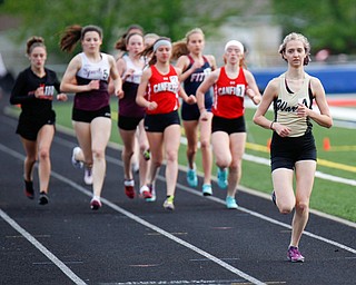 Warren G. Harding's Audrey Masters leads the pack during the first lap of the Girls 1600 Meter Run at the All-American Conference Red Tier High School Track Championships at Austintown Fitch Greenwood Chevrolet Falcon Stadium on Tuesday. EMILY MATTHEWS | THE VINDICATOR