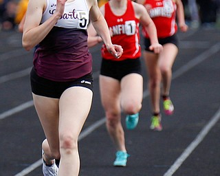 Boardman's Raegan Burkey finished in the lead for the Girls 1600 Meter Run at the All-American Conference Red Tier High School Track Championships at Austintown Fitch Greenwood Chevrolet Falcon Stadium on Tuesday. EMILY MATTHEWS | THE VINDICATOR