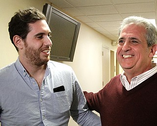 In a bitter race that saw each candidate criticize the other for poor decisions, Martin Hume beat Jeff Limbian in the Democratic primary for Youngstown Municipal Court judge. Hume, right, is shown with his son Jeremy at the Mahoning County Board of Elections.