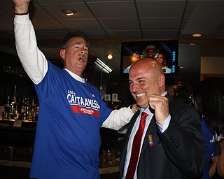 Enzo Cantalamessa, right, is jubilant as Gary Steinbeck, former district director of the United Steelworkers Union leads a cheer as election results showed that Cantalamessa is the apparent victor in his race for Warren law director. The celebration took place at the family's restaurant, Enzo's in Warren.