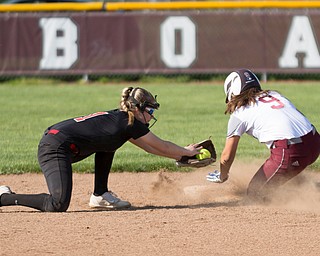 Boardman's Dana Haus gets past Canfield's Jackie Kinnick's tag to safely steal second during their game at Boardman on Wednesday. Boardman won 6-0. EMILY MATTHEWS | THE VINDICATOR