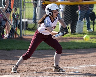 Boardman's Vanessa Roush squares for a bunt during their game against Canfield on Wednesday. Boardman won 6-0. EMILY MATTHEWS | THE VINDICATOR