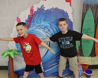Neighbors | Abby Slanker.Two C.H. Campbell Elementary School first-grade students pretended they were surfing as they celebrated the school’s annual Beach Day on April 18.