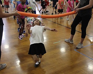 Neighbors | Abby Slanker.C.H. Campbell Elementary School students did the limbo as they celebrated the school’s annual Beach Day on April 18.
