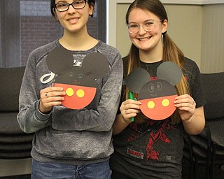Neighbors | Abby Slanker.Canfield High School seniors and National Honor Society members Isabella Audia (right) and Mariah Cashbaugh (left) had a Spring Sing at the Canfield library on April 13, as their NHS service project..