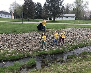 Neighbors | Submitted.Poland students celebrated Earth Day by cleaning up the grounds around Poland Seminary High School April 24.