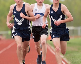 From left, McDonald's Connor Symbolik, Jackson Milton's Cole Graham, and McDonald's Elliot Gibbons push for the lead during the Boys 3200 Meter Run at the Mahoning Valley Athletic Conference High School League Championship Meet at Western Reserve High School on Thursday. EMILY MATTHEWS | THE VINDICATOR