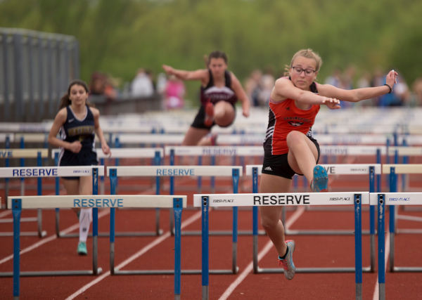 Springfield's Paityn Blinksy takes the lead during the first section of the Girls 100 Meter Hurdles at the Mahoning Valley Athletic Conference High School League Championship Meet at Western Reserve High School on Thursday. EMILY MATTHEWS | THE VINDICATOR