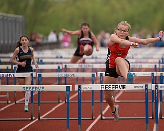 Springfield's Paityn Blinksy takes the lead during the first section of the Girls 100 Meter Hurdles at the Mahoning Valley Athletic Conference High School League Championship Meet at Western Reserve High School on Thursday. EMILY MATTHEWS | THE VINDICATOR