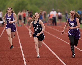 From left, Seb. McKinley's Mary Quinn, McDonald's Anastasia Christiansen, and Seb. McKinley's Kalyn Mudrick compete in the first section of the Girls 100 Meter Dash at the Mahoning Valley Athletic Conference High School League Championship Meet at Western Reserve High School on Thursday. Christiansen finished in first. EMILY MATTHEWS | THE VINDICATOR