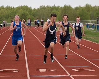 From left, Western Reserve's Russell Adair, McDonald's Jack Bucan, Lowellville's Vinny Layko, and Lowellville's Nick Wellington compete in the first section of the Boys 100 Meter Dash at the Mahoning Valley Athletic Conference High School League Championship Meet at Western Reserve High School on Thursday. Bucan finished in first. EMILY MATTHEWS | THE VINDICATOR