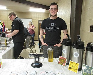Neighbors | Jessica Harker .Troy Metzger, the whole sale manager at Branch Street Coffee offered free tea samples to communityt members gathered at Austintown Park's Mothers Day Farmers Market May 3.
