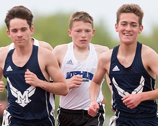 McDonald High School's Connor Symbolik, left, Jackson Milton's Cole Graham, and McDonald's Elliot Gibbons push for the lead during the boys 3200-meter run at the Mahoning Valley Athletic Conference High School League championship meet at Western Reserve High School on Thursday. 