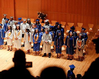The audience watches as the Youngstown Rayen Early College Class of 2019 files into DeYor 's Ford Recital Hall for their commencement ceremony on Friday. EMILY MATTHEWS | THE VINDICATOR