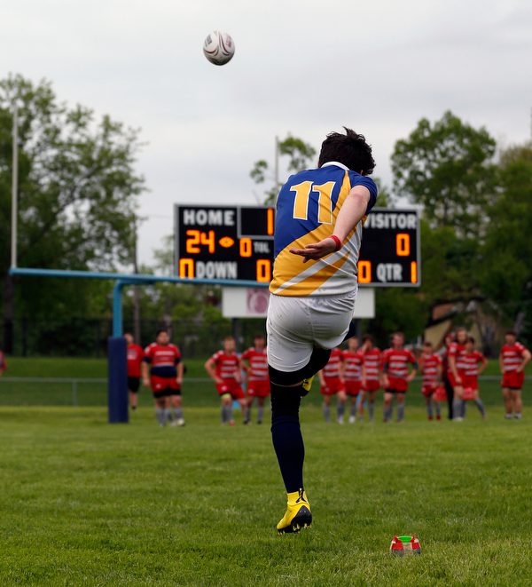 YOUNGSTOWN, OHIO - May 10, 2019: Rugby- Northwest Indians vs East Golden Bears.  East Golden Bears' Hunter Mathie (11) kicks for the try during the 1st half at Rayen Stadium. Photo by MICHAEL G. TAYLOR | THE VINDICATOR
