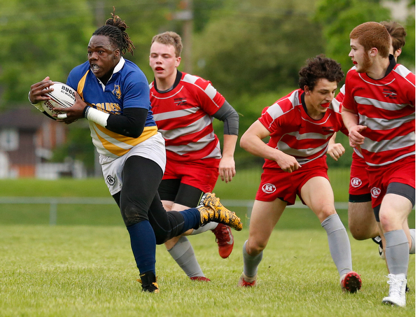 YOUNGSTOWN, OHIO - May 10, 2019: Rugby- Northwest Indians vs East Golden Bears. East Golden Bears' Dmarcus Carr (12, with ball) runs away from Northwest Indians' defense to score during the 1st half at Rayen Stadium. Photo by MICHAEL G. TAYLOR | THE VINDICATOR