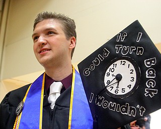 William D. Lewis the Vindicator  YSU grad Billy Blaze of Hermitage shows off a message he placed on his cap.