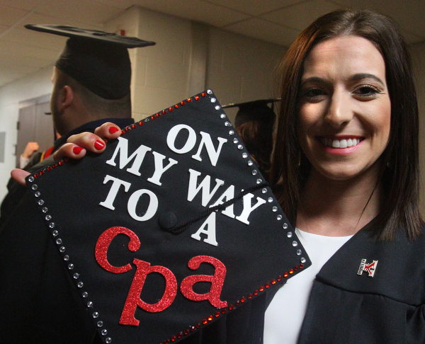 William D. Lewis the Vindicator  YSU grad Amy Jackson of Campbell shows off a message she placed on her cap.