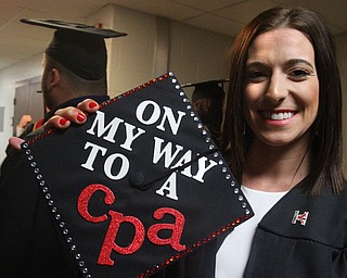 William D. Lewis the Vindicator  YSU grad Amy Jackson of Campbell shows off a message she placed on her cap.