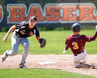 Springfield's Drew Clark attempts to catch the ball as South Range's Trey Pancake slides in to second for a steal during their game on Saturday at Springfield High School. Springfield won in the 10th inning 9-8. EMILY MATTHEWS | THE VINDICATOR