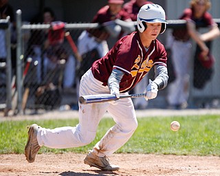 South Range's Luke Blasko goes for a bunt during their game against Springfield on Saturday at Springfield High School. Springfield won in the 10th inning 9-8. EMILY MATTHEWS | THE VINDICATOR