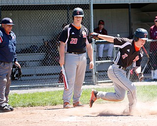 Springfield's Chris Thompson (20) steps out of the box as NIck Slike steals home during their game against South Range on Saturday at Springfield High School. Springfield won in the 10th inning 9-8. EMILY MATTHEWS | THE VINDICATOR