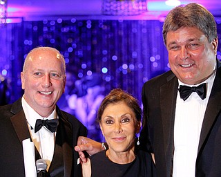 Bob Hannon, left, president of the United Way of Youngstown and Mahoning County, Mary Pipino of Youngstown, who placed the winning bid for the final Lordstown-built Chevrolet Cruze, and Ed Muransky, a local entrepreneur and Pipino’s brother-in-law, pose for a photo Friday night during the United Way’s centennial gala at The Lake Club in Poland.
