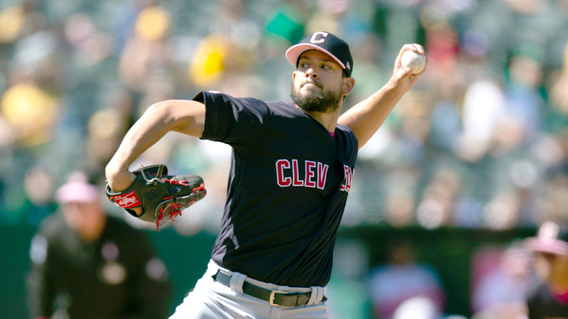 Cleveland Indians pitcher Brad Hand delivers a pitch against the Oakland Athletics during the ninth inning of a game Sunday in Oakland, Calif.