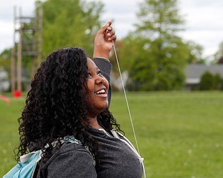 Nakaia McRae, 16, an 11th grader at Chaney High School, flies a kite during a fundraiser for Save the Children, an organization that helps child refugees, on the track at Chaney High School on Tuesday afternoon. EMILY MATTHEWS | THE VINDICATOR