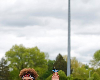 Luis Vazquez, 18, an 11th grader at Chaney High School, flies a kite during a fundraiser for Save the Children, an organization that helps child refugees, on the track at Chaney High School on Tuesday afternoon. EMILY MATTHEWS | THE VINDICATOR