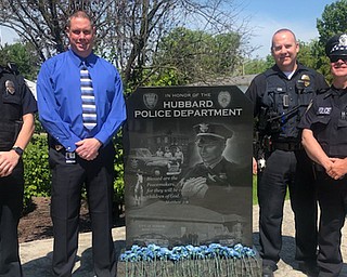 Hubbard police Officer B.J. Fronzaglio, incoming interim police Chief Bob Thompson, Detective Chris Moffitt and Hubbard police officer Ted Thirion stand next to the Hubbard Police Department statue on National Peace Officer Memorial Day.