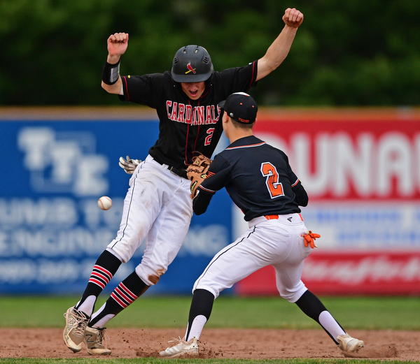 STRUTHERS, OHIO - MAY 15, 2019: Howland's Gage Tomko loses possession of the ball while attempting to tag out Canfield's Brent Herrmann after he was caught in a rundown in the second inning of Wednesday nights OHSAA Tournament game at Cene Park. DAVID DERMER | THE VINDICATOR