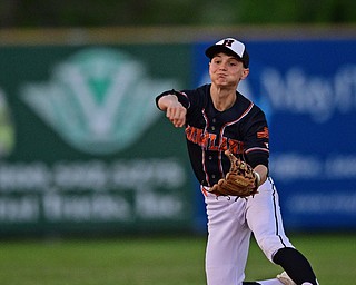 STRUTHERS, OHIO - MAY 15, 2019: Howland's Gage Tomko throws to first to get out Canfield's Jad Jaddallah in the third inning of Wednesday nights OHSAA Tournament game at Cene Park. The Howland runner would be ace at first base. DAVID DERMER | THE VINDICATOR